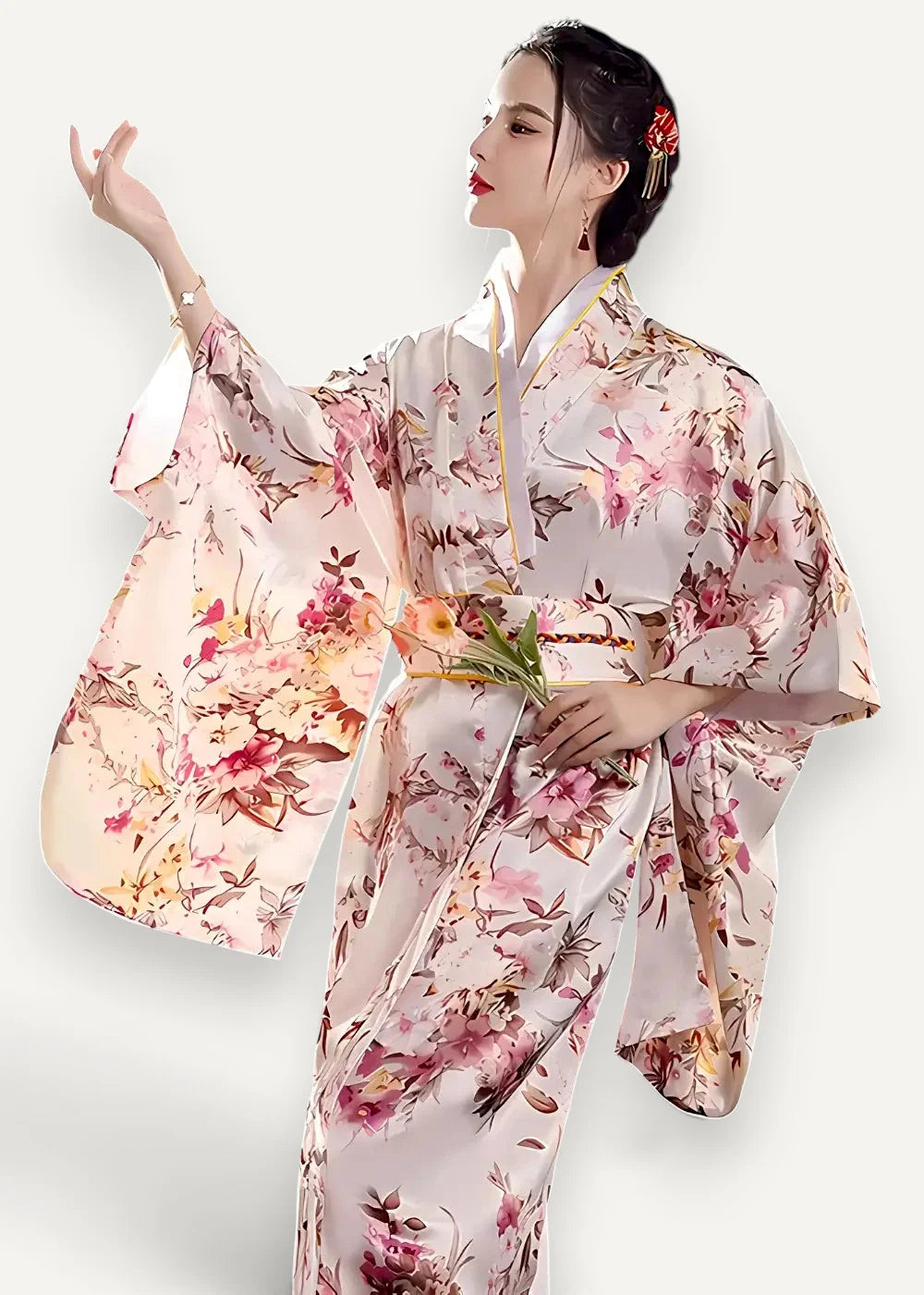A flowing light pink satin robe with a delicate rose and peach floral pattern made of silk