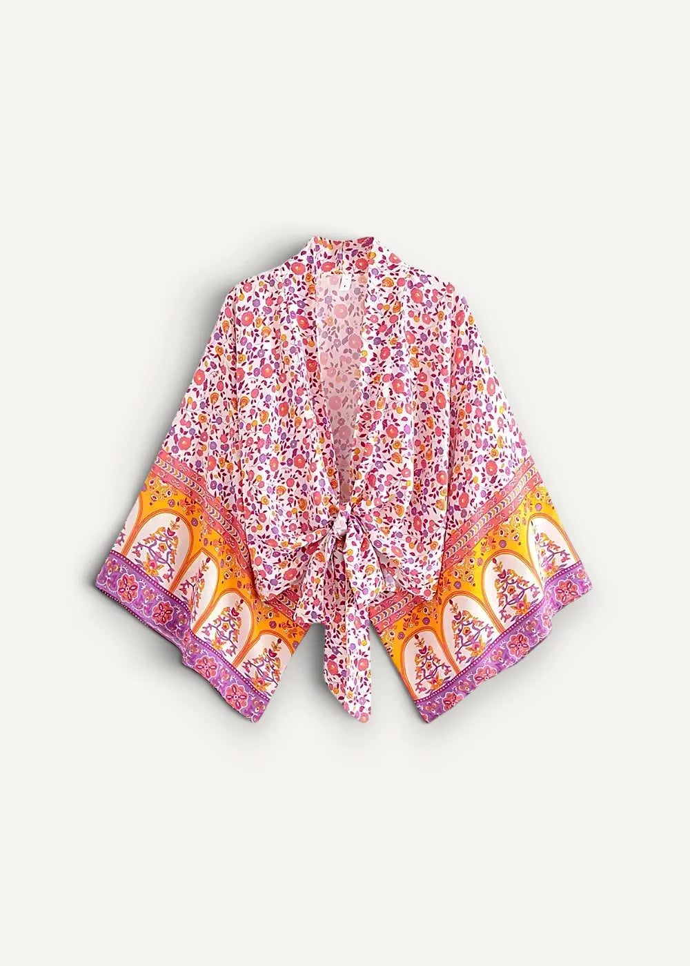 A flowing open-front pink kimono beach cover up with vibrant orange floral pattern and purple trim