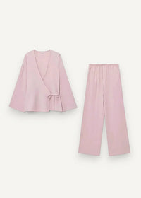 A soft blush pink kimono set with a loose wrap top featuring bell sleeves and matching wide-leg pants loungewear