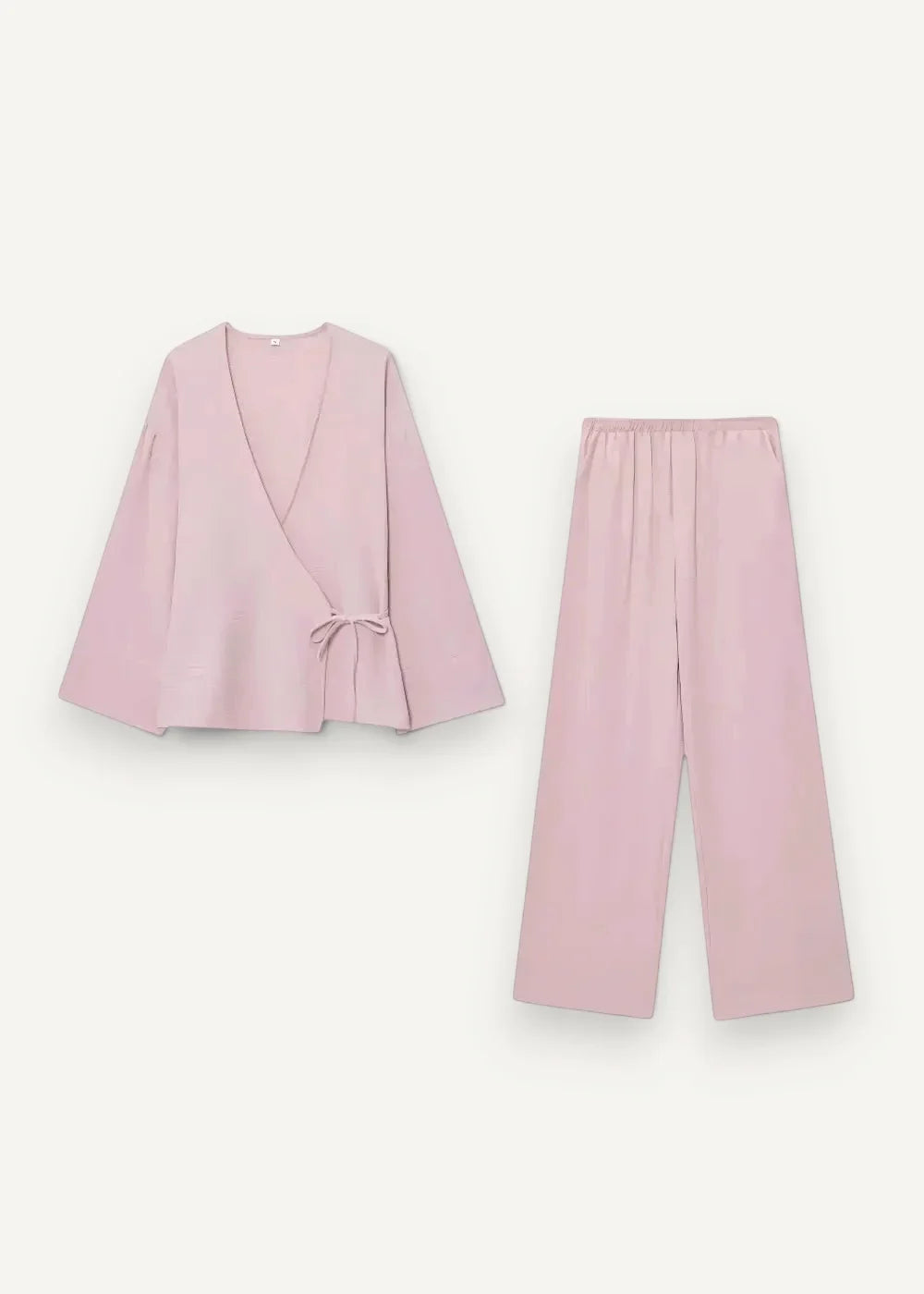 A soft blush pink kimono set with a loose wrap top featuring bell sleeves and matching wide-leg pants loungewear