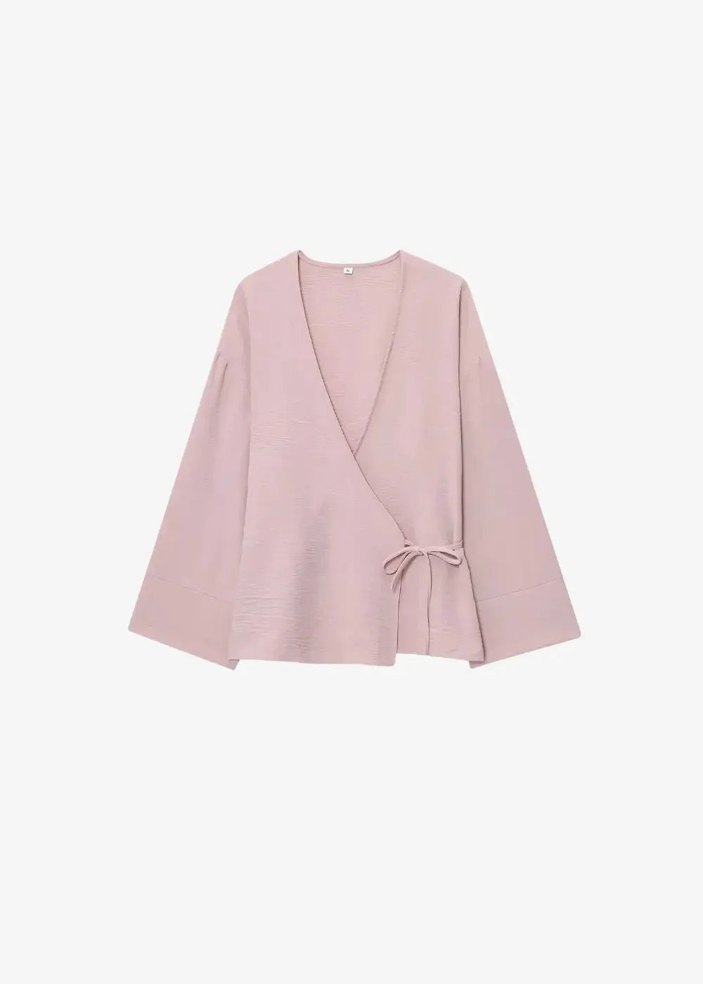 A soft blush pink kimono set featuring a wrap-style top with wide sleeves and a tied waist detail