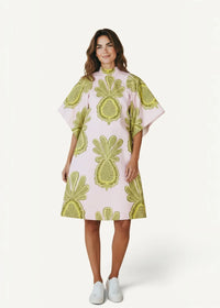 Pink kimono style dress in light pink with bold lime green pineapple pattern and wide cape-like sleeves
