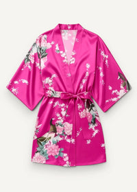 Pink satin short robe in vibrant fuchsia with floral and bird pattern and matching belt tied at the waist