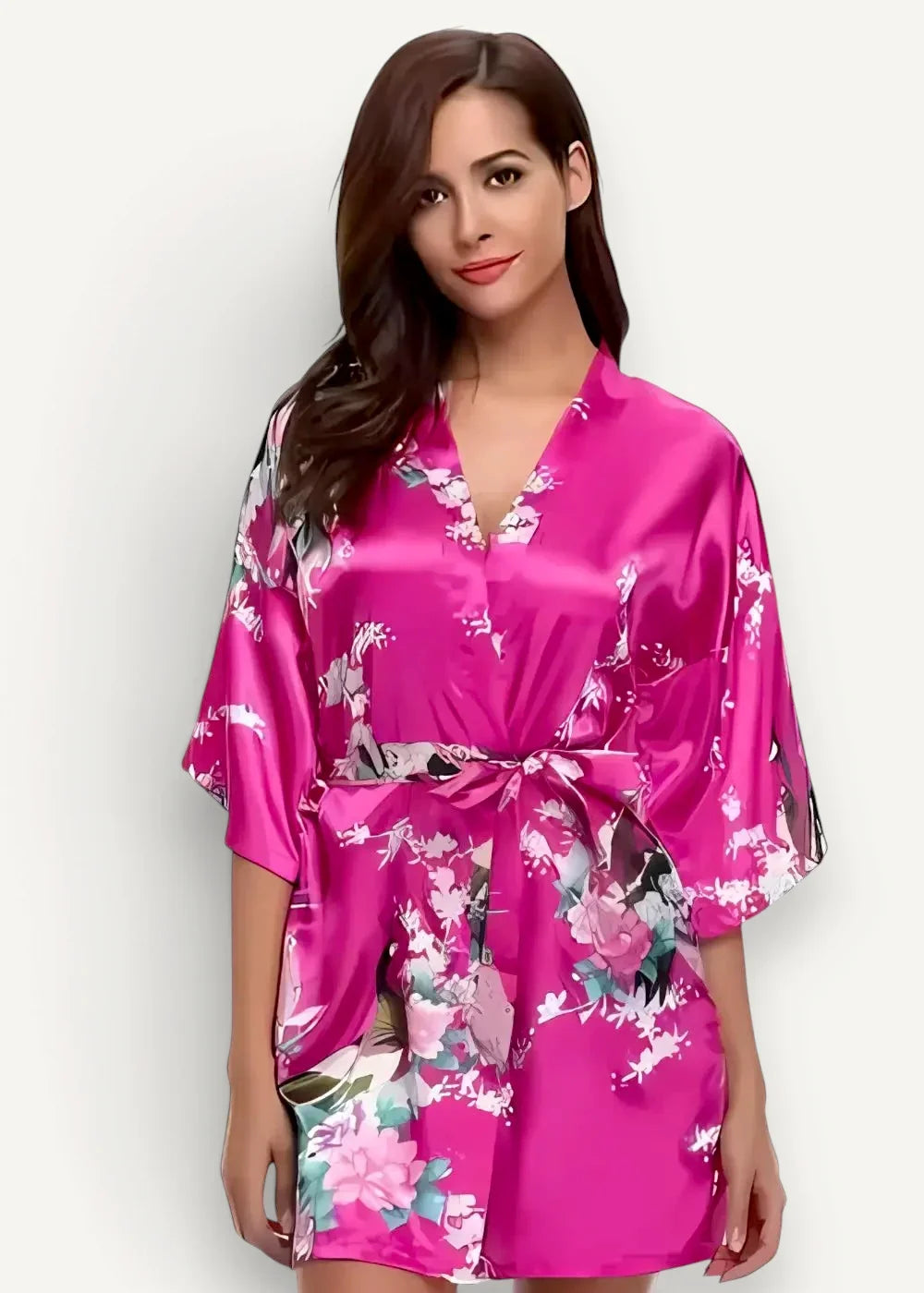 A vibrant fuchsia pink satin short robe with floral pattern three-quarter sleeves and a self-tie belt