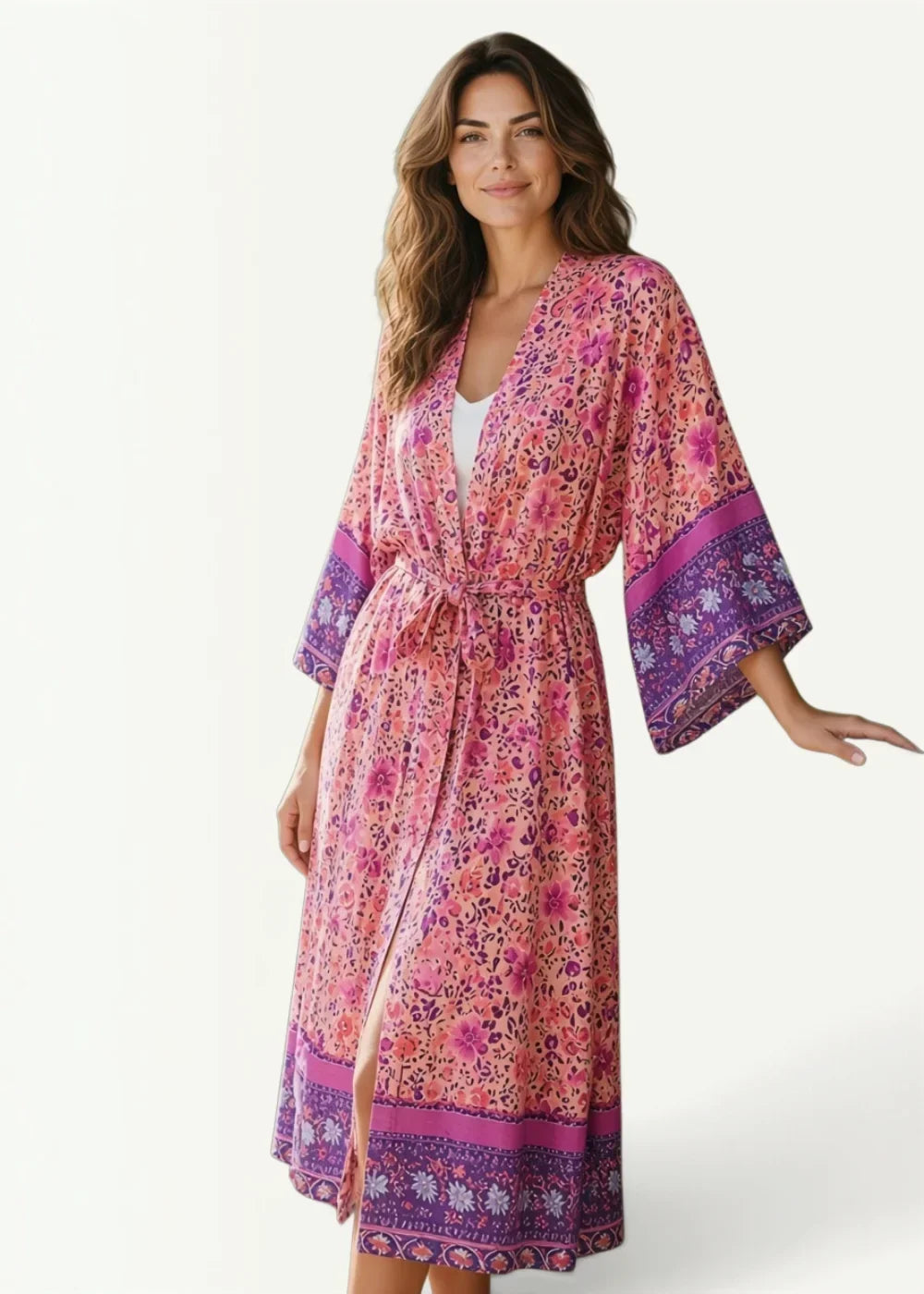 Plus size kimono cardigan in flowing pink and purple floral print with v-neckline belted waist and wide sleeves