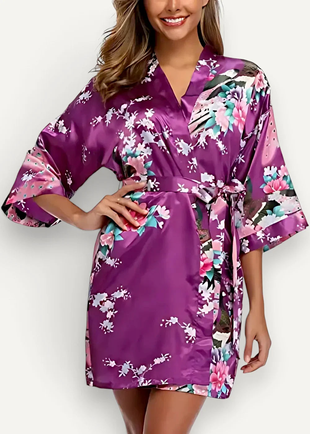 Purple satin kimono robe with a vibrant floral pattern in pink white and teal on smooth satin fabric