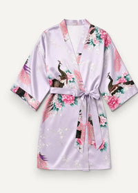 Purple satin robe in lavender with a delicate peacock and floral pattern featuring pink blossoms and green leaves