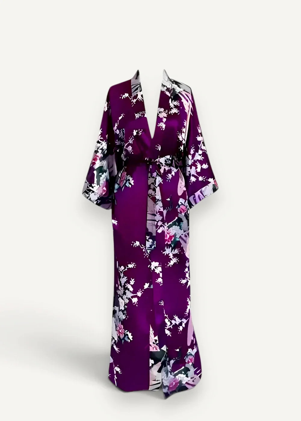 A flowing purple silk robe with a delicate pink white and black floral pattern for elegant loungewear