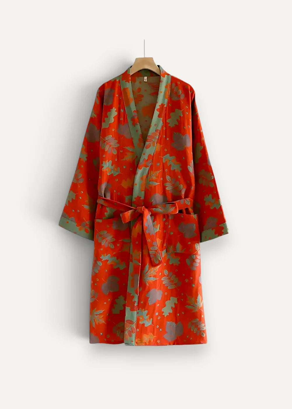 Red Japanese kimono robe in vibrant orange with leafy green and brown pattern and matching waist belt