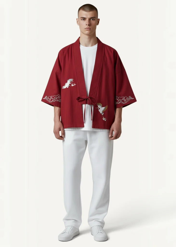 Red kimono jacket featuring red embroidered yamato fabric with white bird and wave motifs on the back side