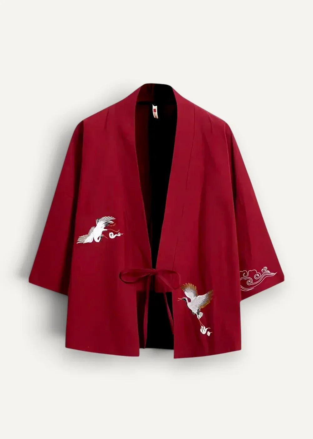Red kimono jacket in rich crimson with delicate white and gold crane and cloud embroidery on the sleeves