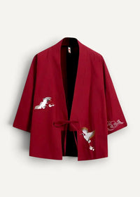 Red kimono jacket in rich crimson with delicate white and gold crane and cloud embroidery on the sleeves