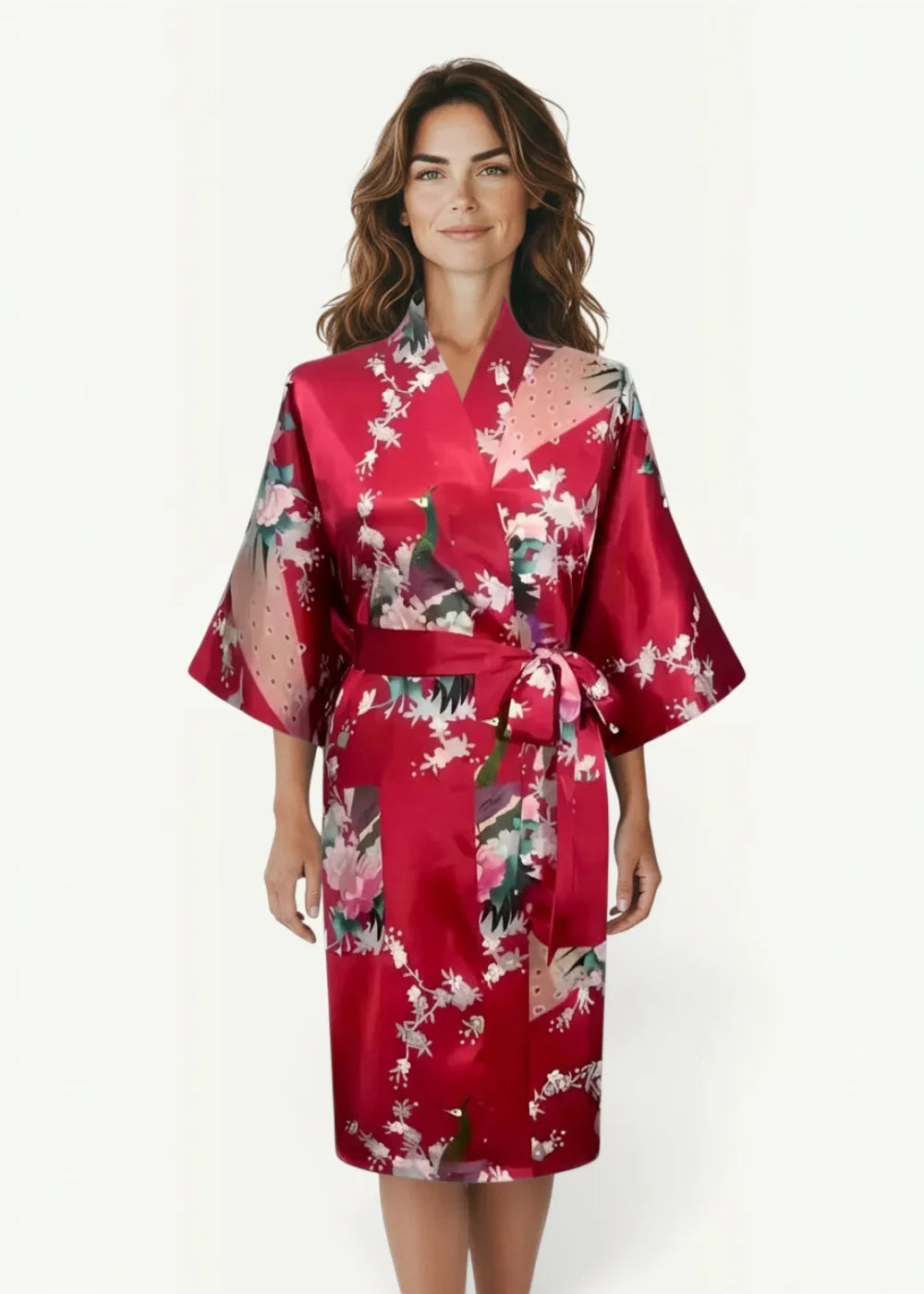 A vibrant red satin robe for women featuring a floral and peacock pattern tied at the waist with a matching belt