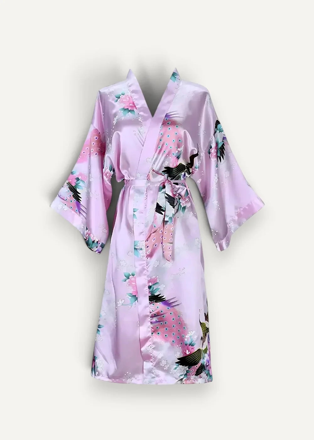 A soft pink satin Japanese kimono robe with delicate floral and bird patterns and a matching belt tied at the waist