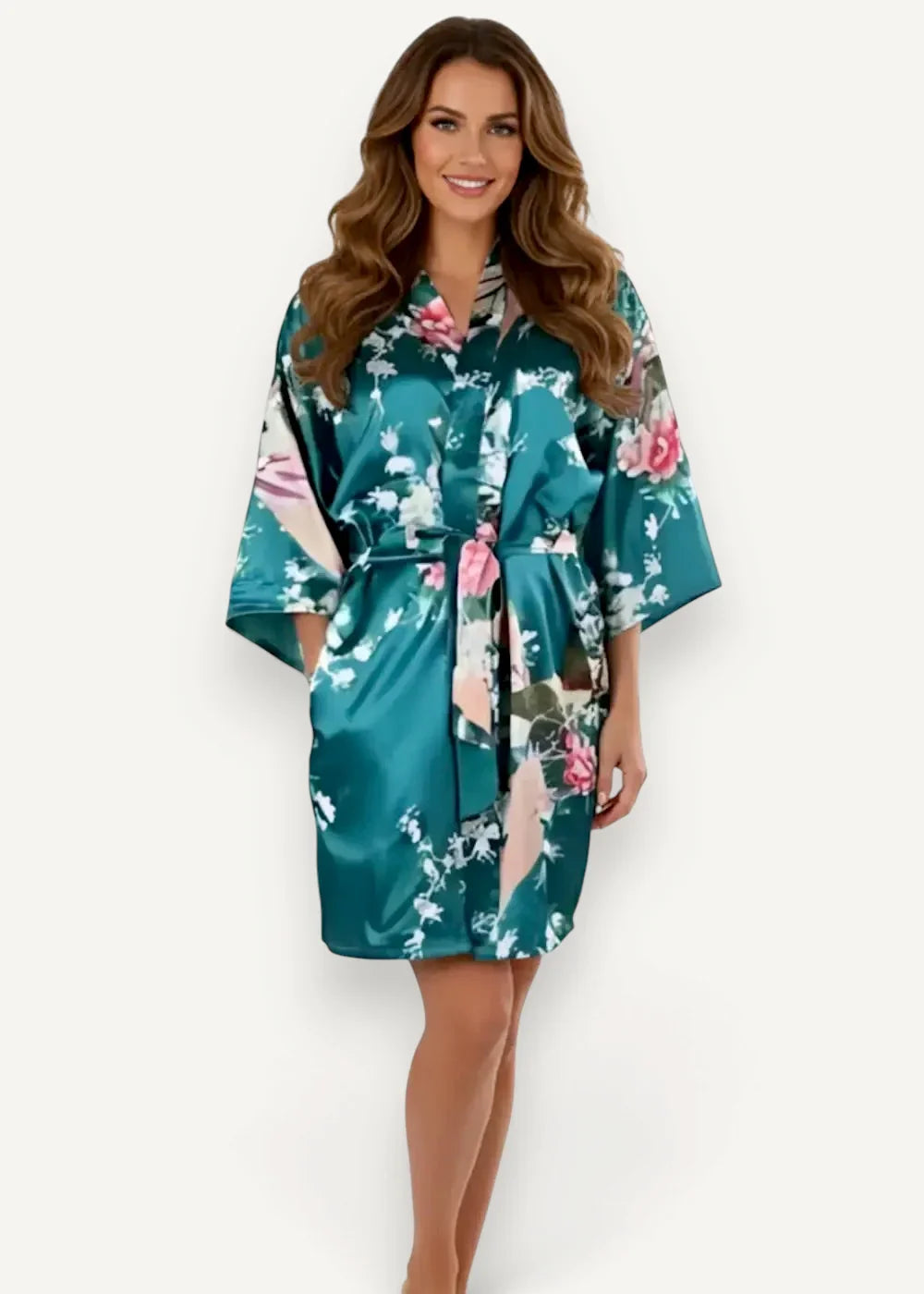 Teal satin kimono short with pink and white floral pattern and matching belt ties made of smooth satin fabric