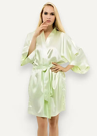 A light green satin robe for women with a v-neck wide sleeves and waist tie in smooth satin fabric