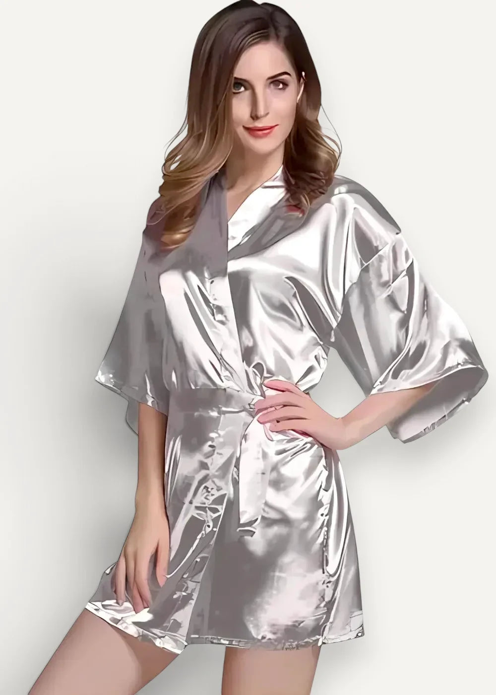 A shimmering silver satin robe for women with a belted waist and wide flowing sleeves