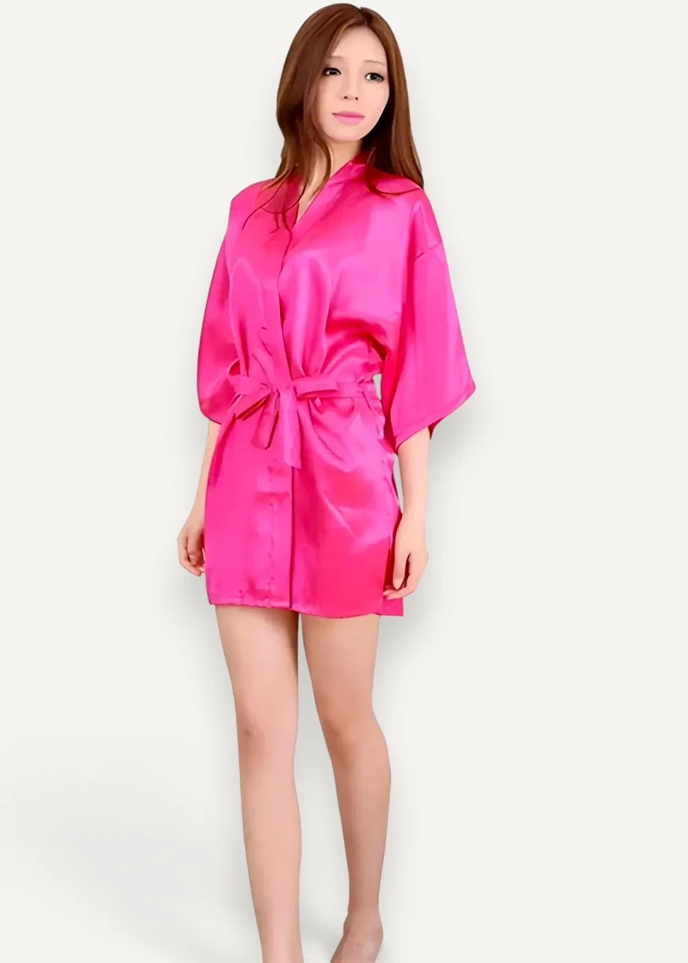 A vibrant pink satin robe for women with a belted waist and three quarter length sleeves