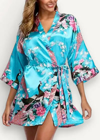 Turquoise satin wrap robe with floral and peacock pattern featuring pink and purple accents for elegant wear