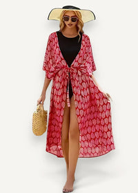 Sheer kimono swim cover up with flowing pink leaf pattern tie front design and three quarter sleeves