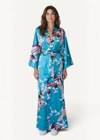 A vibrant turquoise silk bath robe with a delicate pink purple and white floral and peacock satin pattern