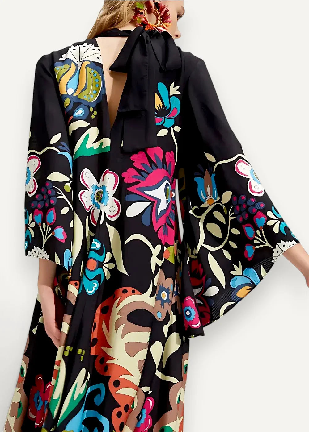 Black floral print silk kimono dress with vibrant botanical patterns and back tie detail shown from the back