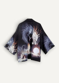 Black silk kimono jacket with intricate white and silver dragon designs on a dark starry background with a glowing moon