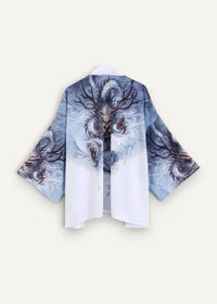 White and blue silk kimono jacket with dragon design dark branches and swirling patterns on the back side