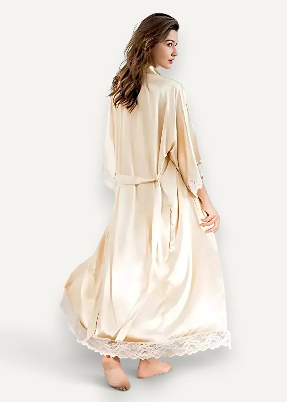 A flowing cream-colored silk lace robe with delicate lace trim along the hem and sleeves