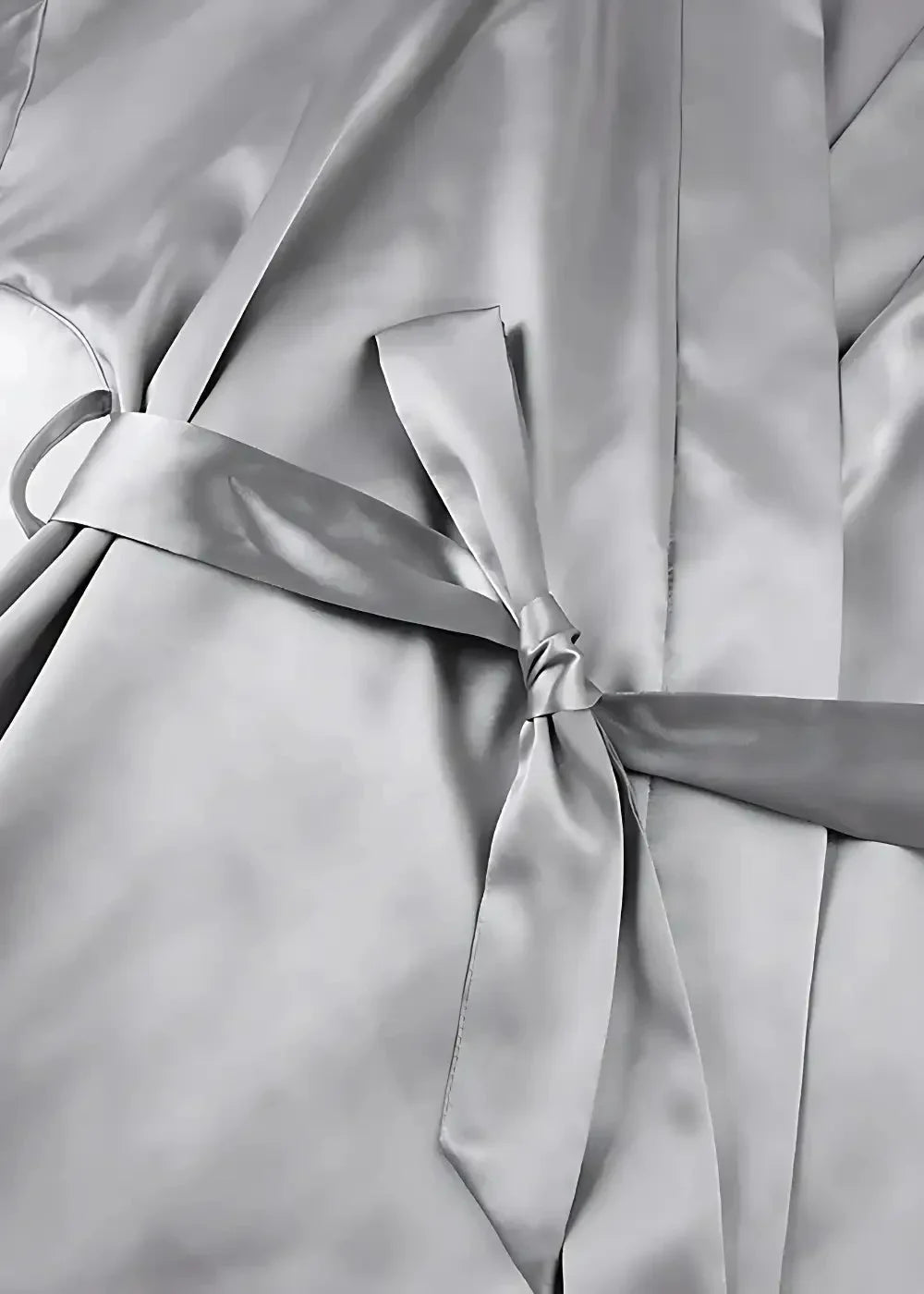 Silver satin robe with matching belt tied in a neat bow made of silk satin for comfortable loungewear