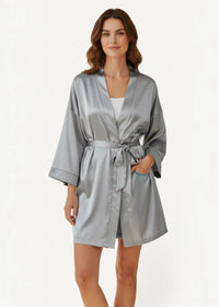 A sleek silver-gray silk satin robe with a matching belt and subtle sheen perfect for lounging or sleepwear