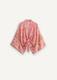 A soft peach-colored silk summer kimono cardigan with delicate floral patterns and gold-trimmed sleeves tied at the front