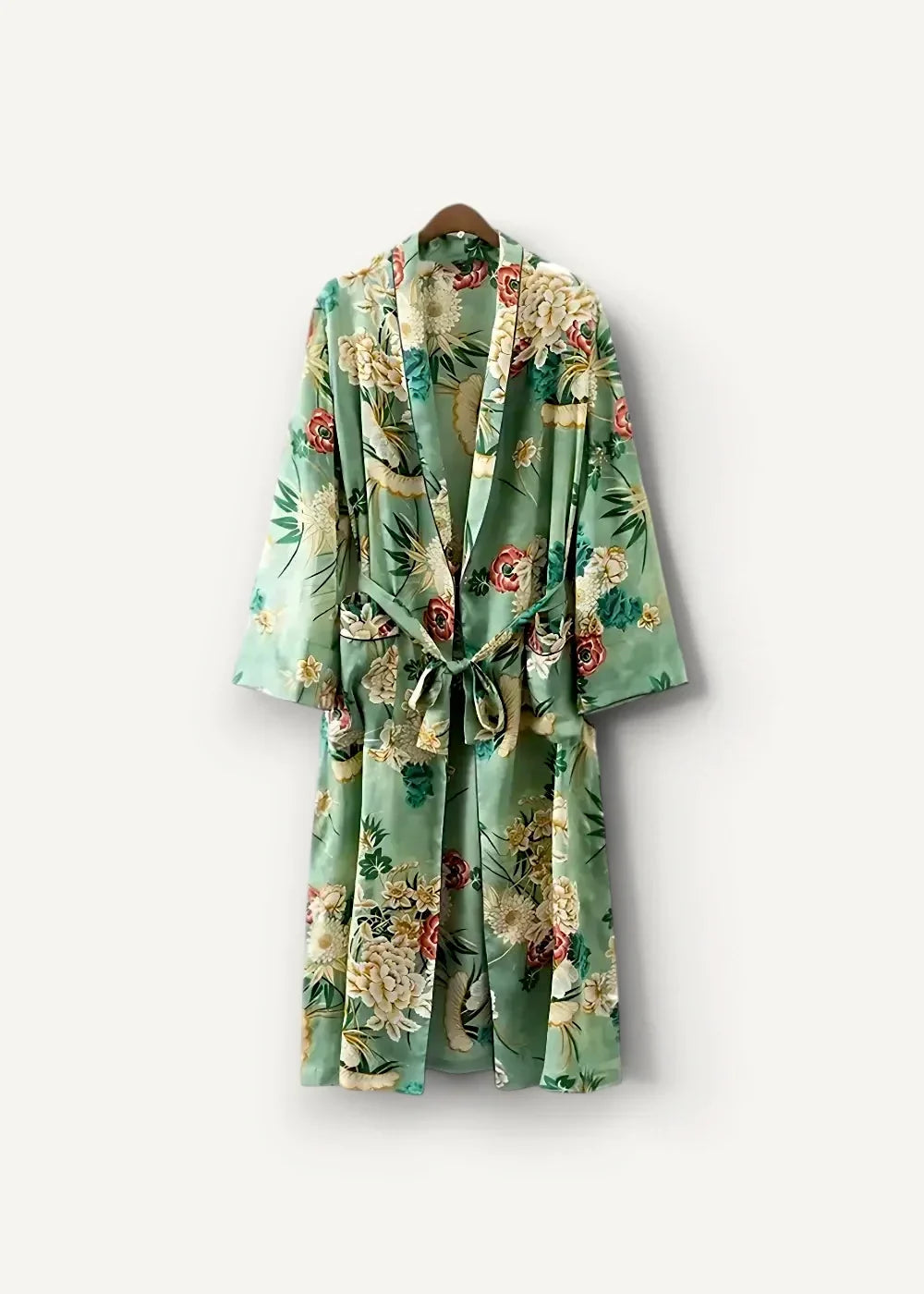 A light green silk summer kimono cover up with vibrant rose and bamboo floral pattern tied at the waist