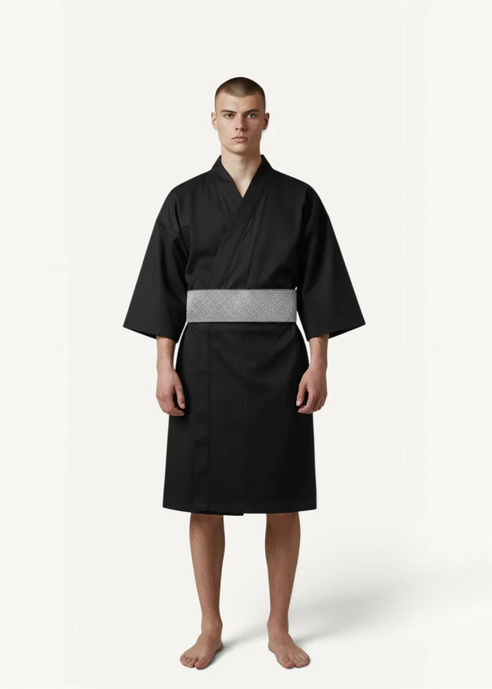 Traditional black kimono featuring a textured silver belt showcasing elegant cultural attire detail