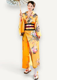 Traditional Japanese kimono female vibrant yellow with intricate floral and bird patterns and black obi belt with pink stripes