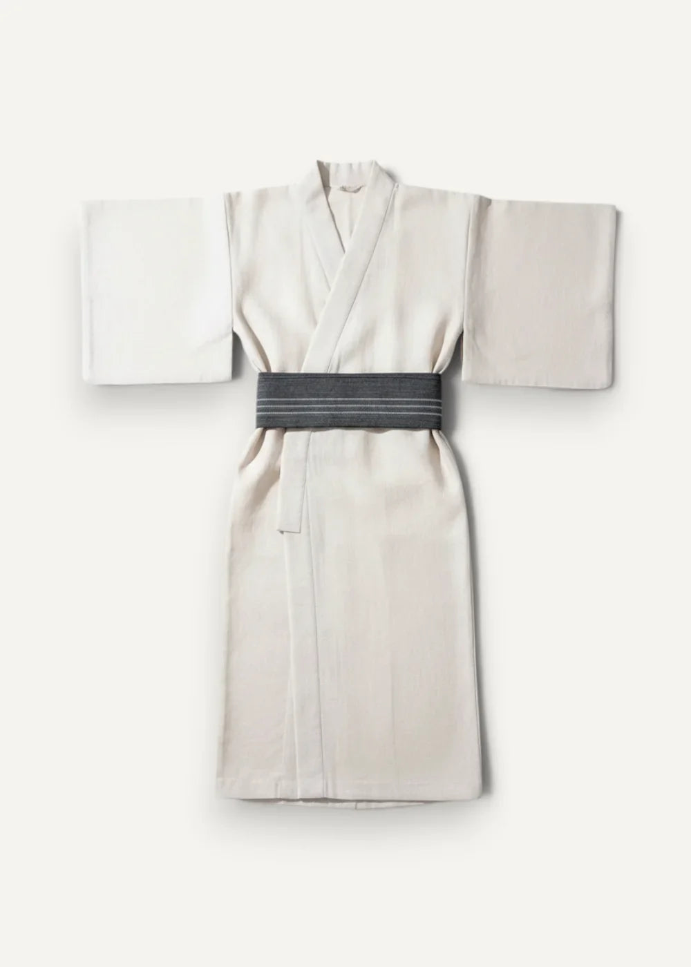 Traditional kimono cream-colored with soft draping wide sleeves and dark gray striped obi belt visible from front