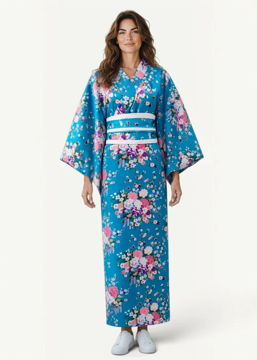 A traditional female kimono in vibrant turquoise floral pattern with wide sleeves and a white obi belt