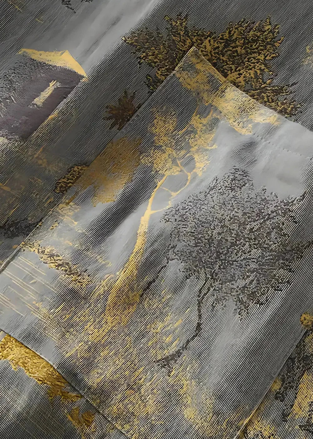 Gray and gold embroidered fabric of traditional kimono robe featuring landscape design with trees mountains and architecture