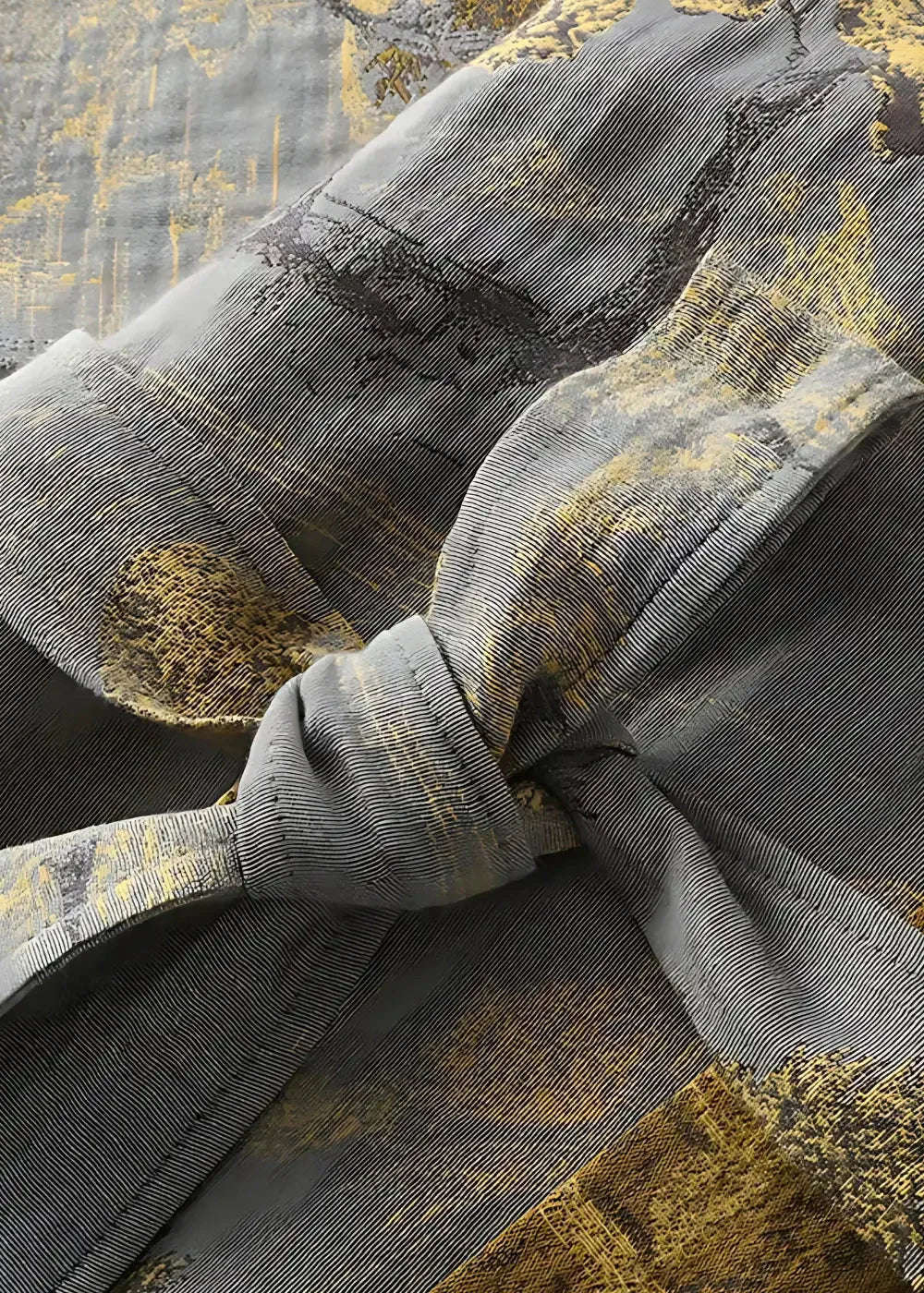Traditional kimono robe with gray and gold textured fabric tied into a decorative knot detail