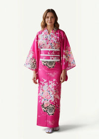 Traditional pink kimono featuring vibrant floral and geometric patterns in white black and soft pastel hues