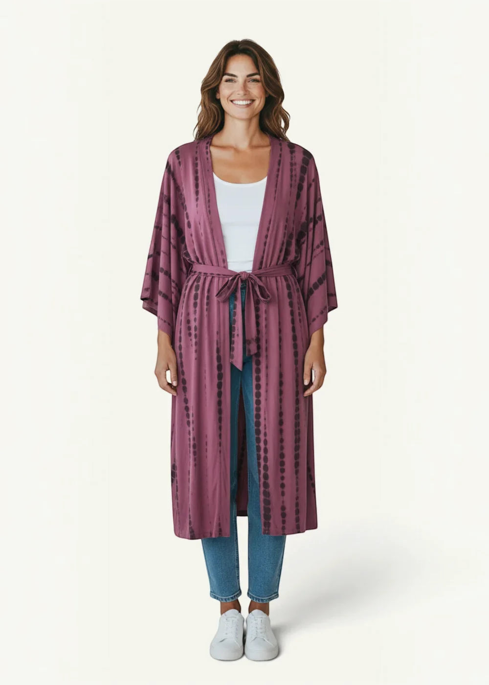 Purple velvet kimono robe with long sleeves and tie-dye pattern featuring a matching belt tied at the waist