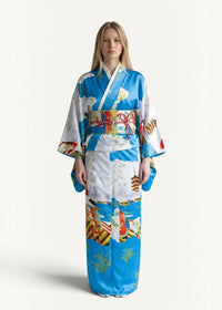 Vintage silk robe in vibrant blue and white with traditional japanese motifs including pagodas boats and floral patterns