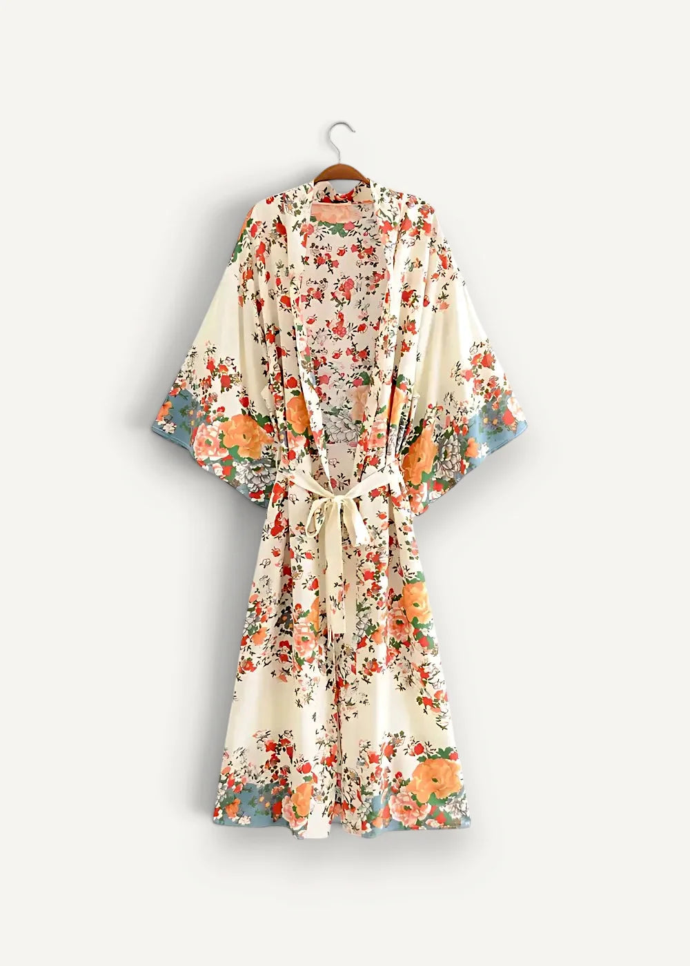 White beach kimono floral robe with flowing off-white fabric and orange red blossoms with soft green leaves