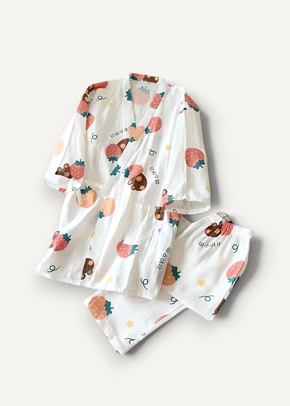 White cotton kimono pajamas with playful strawberry and chocolate print on a pajama set