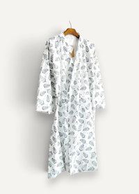 White kimono men robe in white with black leaf pattern hanging on wooden hanger made of lightweight fabric