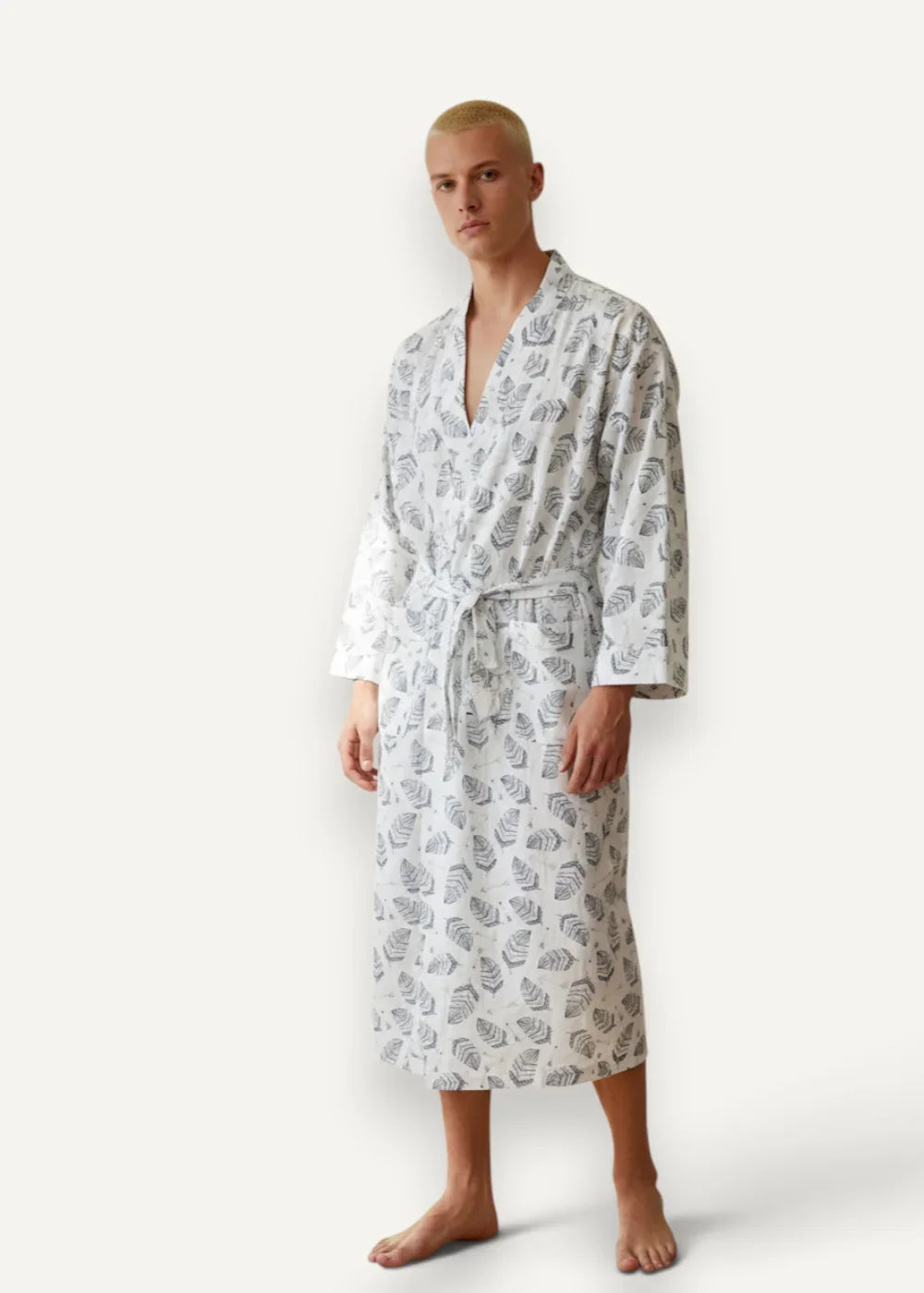 White kimono men robe with a v-neckline gray monstera leaf pattern and matching belt in soft white fabric