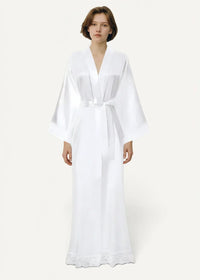 White kimono robe made of flowing white satin with v-neckline wide sleeves and delicate lace trim at the hem