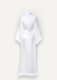 A sleek white satin white kimono robe with high collar wide sleeves and matching belt for elegant loungewear