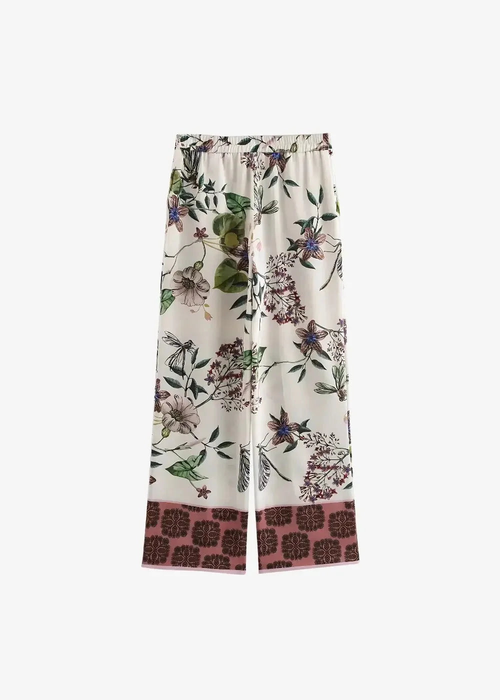 Cream-colored wide-leg pants with intricate green leaves and purple floral print and dusty rose hemband with brown motifs
