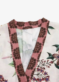 White kimono set featuring a delicate pink and brown floral patterned robe with soft flowing fabric